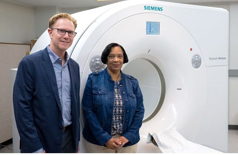 Sterling Johnson stands next to the first CLARiTI participant, Barbara Smith Ballen.