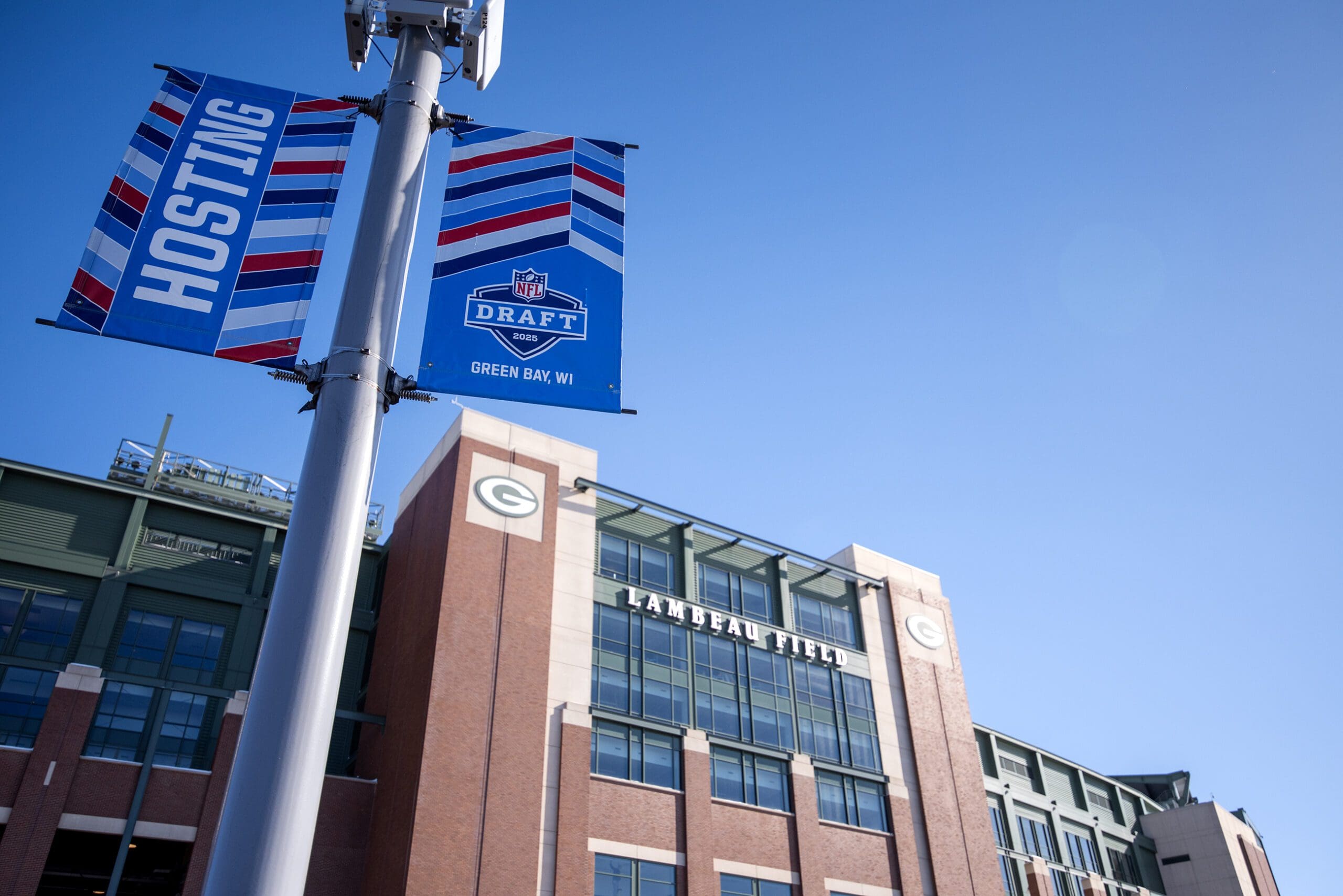 Banners for the upcoming NFL Draft are on display outside Lambeau Field on Thursday, Feb. 13, 2025, in Green Bay, Wis. Angela Major/WPR