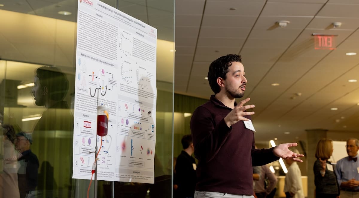 Jorgo Lika explains methods using immune cell metabolism to study disease at a special event.