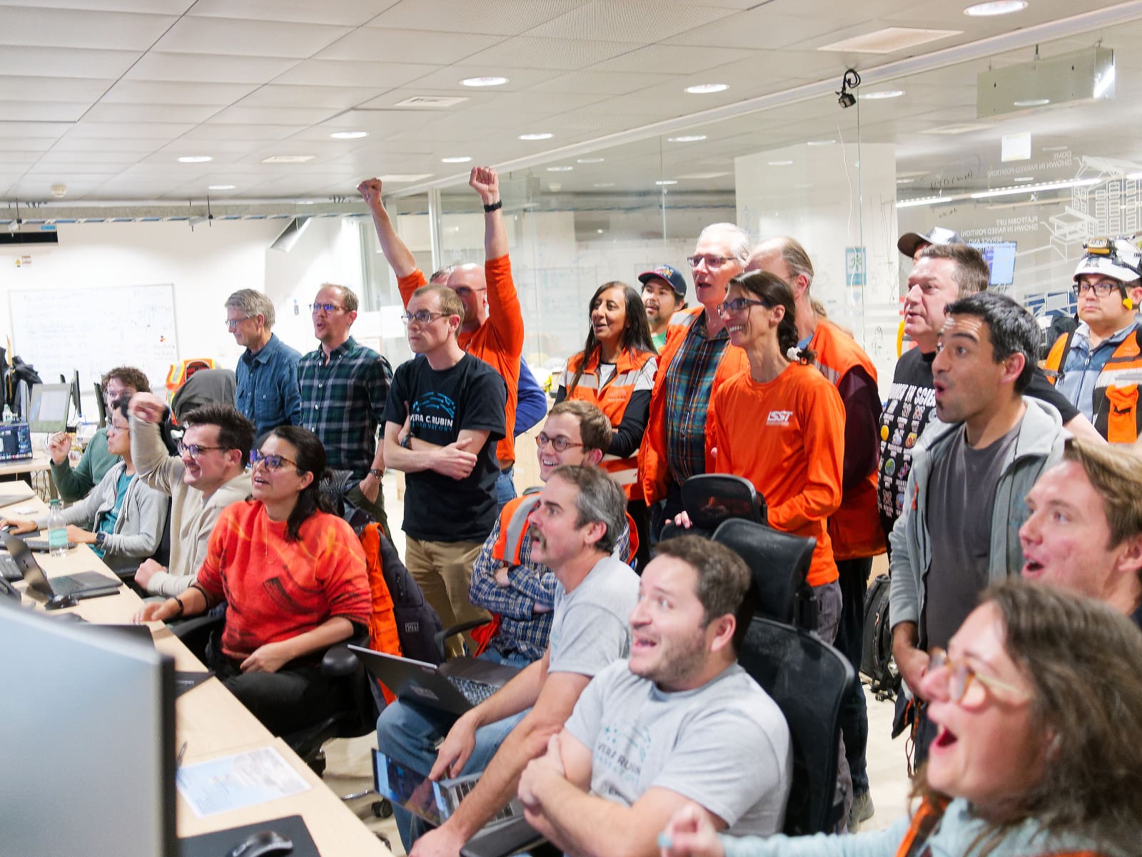 Rubin Observatory scientists, including UW–Madison physics professor Keith Bechtol (in black t-shirt) react as they view some of the first images produced by the observatory’s camera — the largest digital camera in the world. Photo: Wil O’Mullane | Rubin Observatory