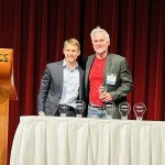 Matt Younkle presents the Biotech award to Luke Roenneburg, Associate Director Genomics & Instrumentation at Promega Corporation